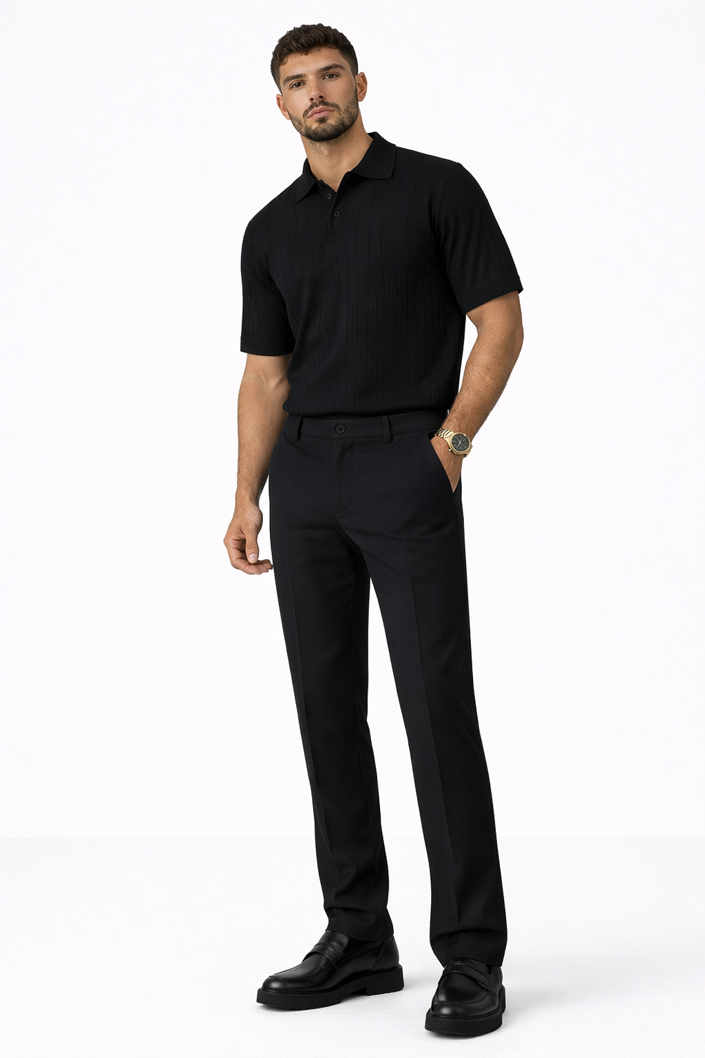 Men’s black tailored dress pants styled with black ribbed polo shirt and black loafers front view