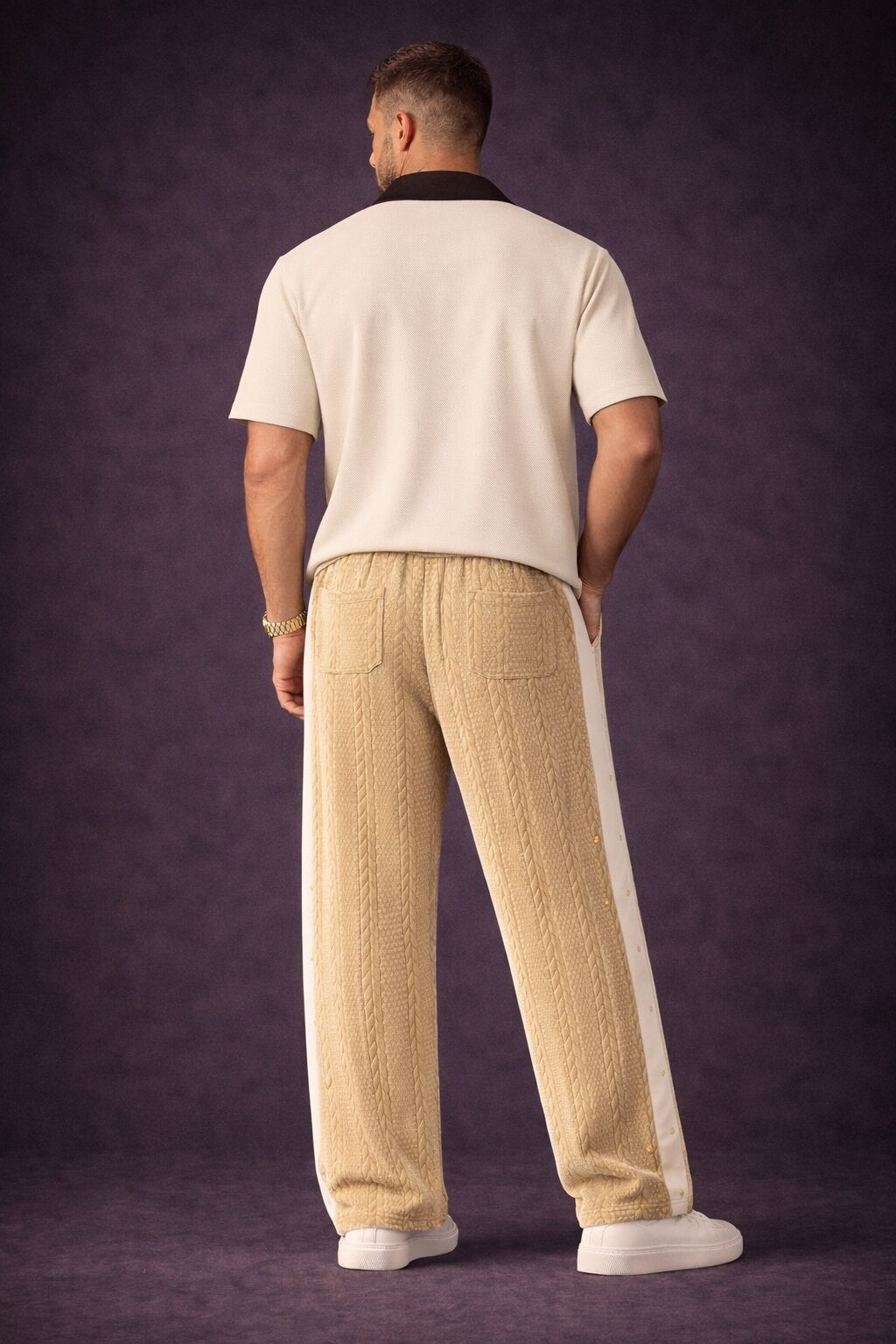 Men’s camel beige waffle knit wide leg pants with side snap detail styled with white contrast shirt and white sneakers back view